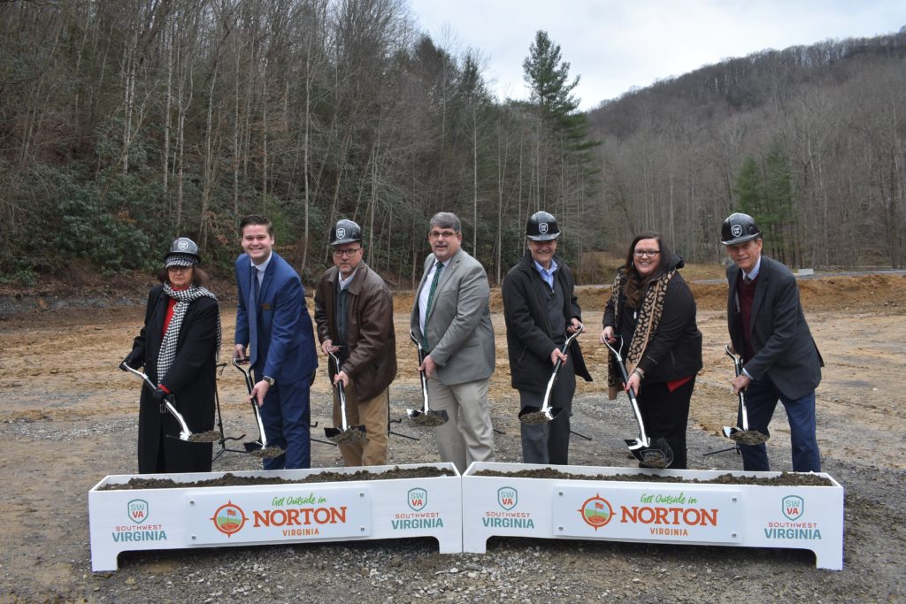 Regional partners with shovels and a box of dirt at the future site of the High Knob Destination Center